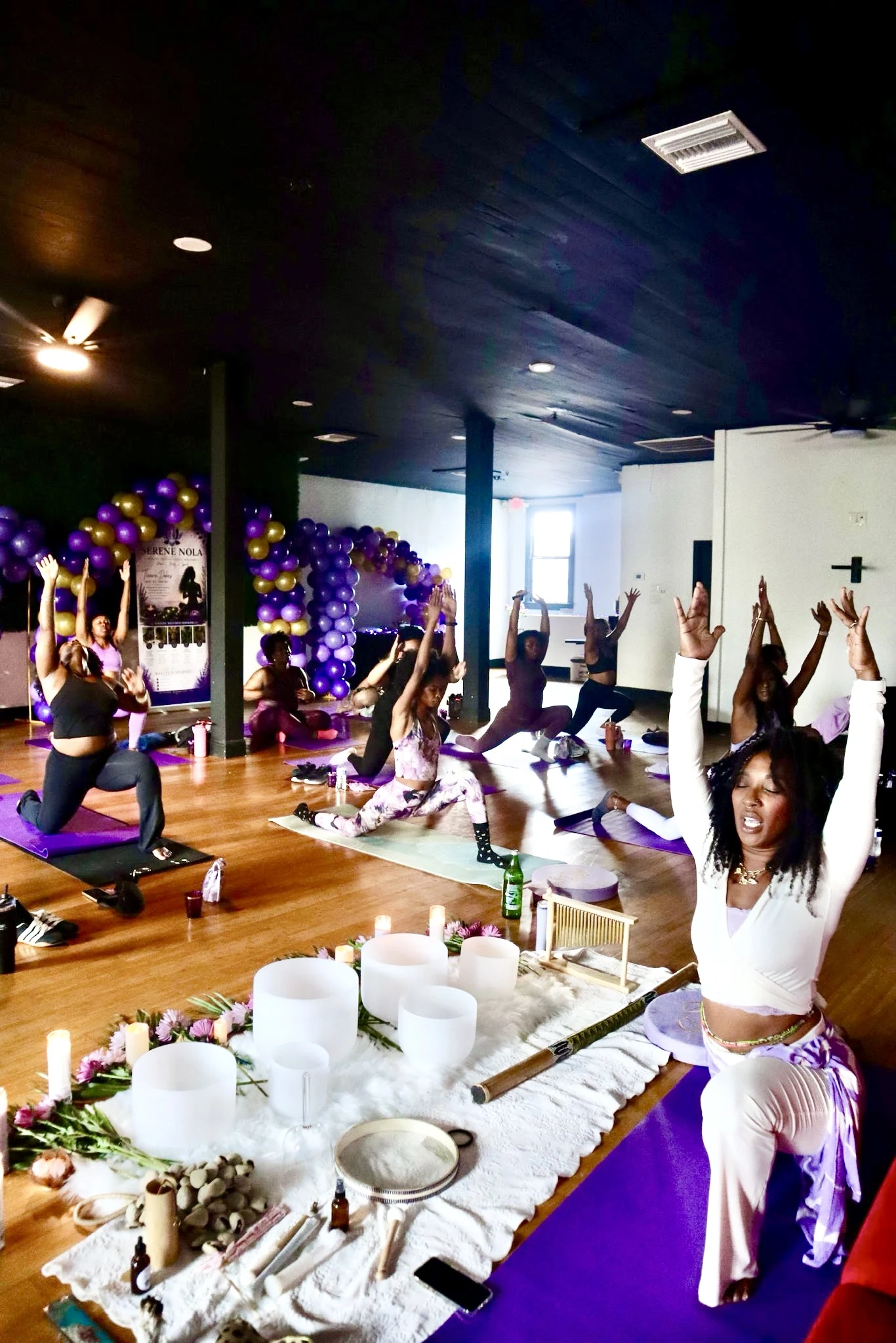 A Serene NOLA group wellness session with yoga and singing bowls