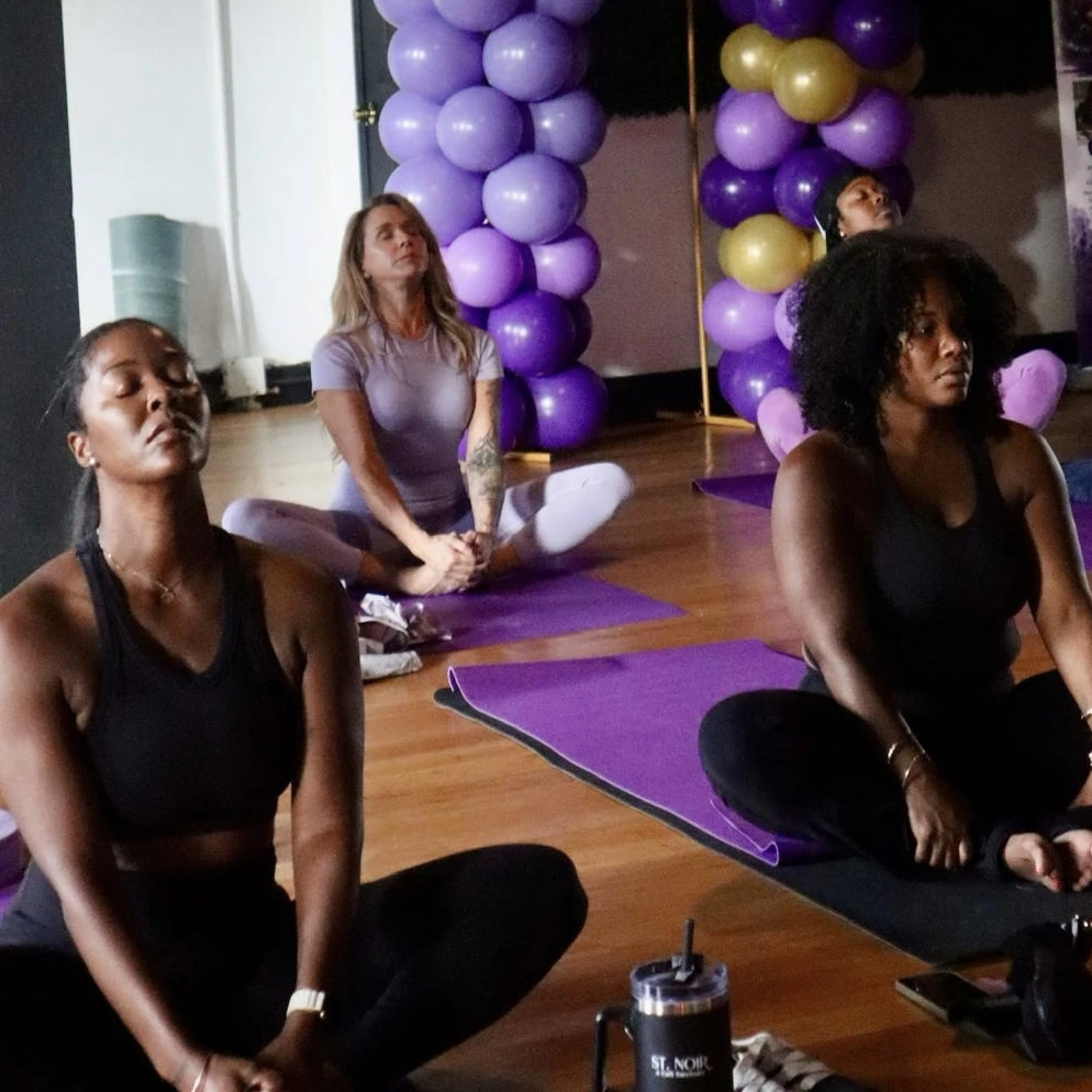 Participants seated in meditation at a Serene NOLA wellness experience