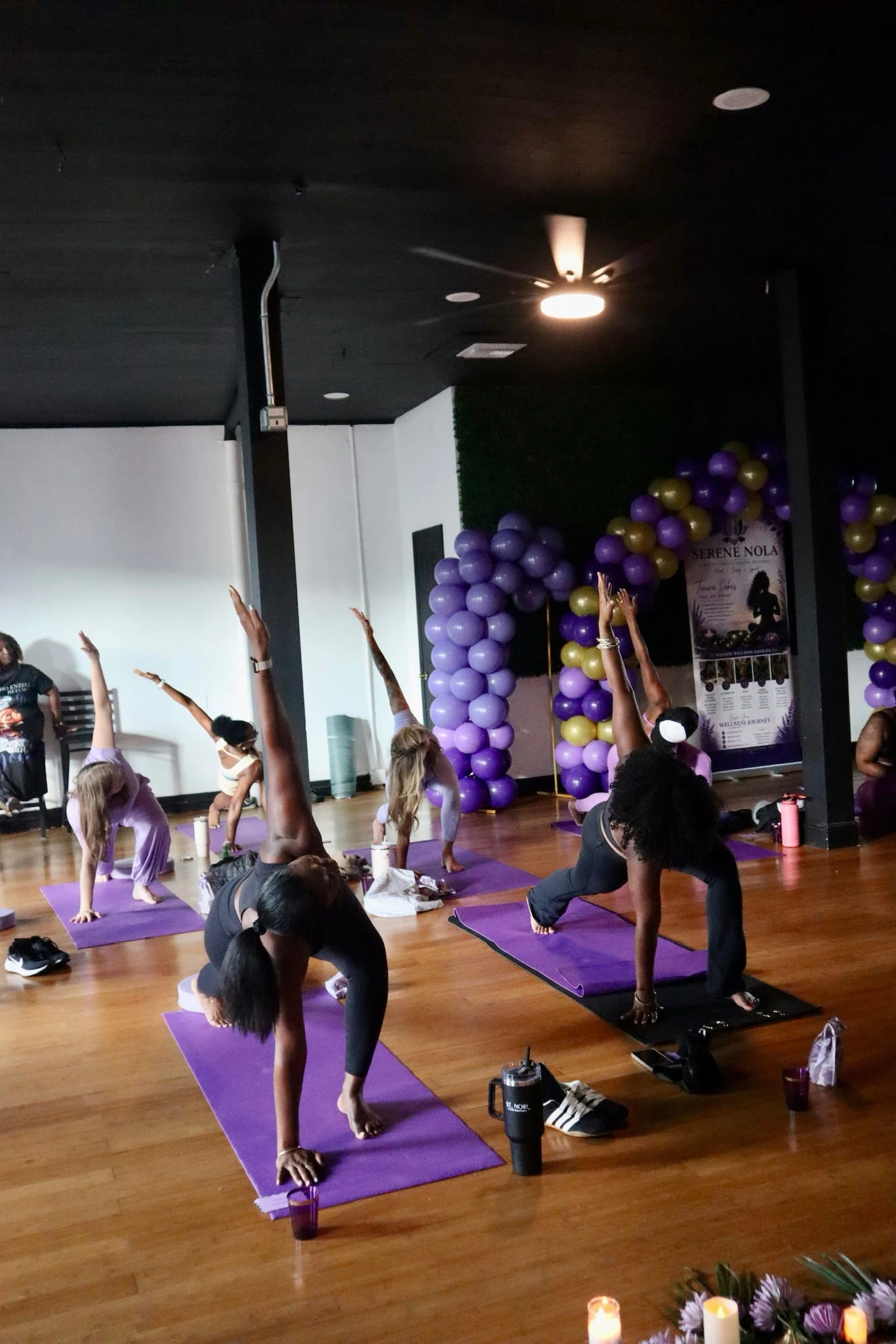 Participants practicing yoga together at a Serene NOLA wellness experience